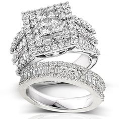 three pieces of white gold with diamonds on each side and two rows of baguettes in the middle