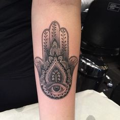 an image of a hamsa tattoo on someone's arm