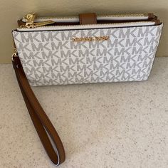 Michael Kors Double Zip Smartphone Wristlet In Gray/White Logo-Print Canvas With Leather Trim And Gold Tone Accents. Never Used. It Was A Birthday Gift In August 2023. White Clutch With Card Slots, White Wallets With Removable Pouch For Everyday Use, Everyday White Clutch Wallet, White Clutch Wristlet With Zipper Closure, White Clutch Wristlet With Wrist Strap, White Clutch With Wrist Strap For Everyday Use, White Wristlet Clutch With Wrist Strap, White Wristlet For Daily Use, White Pouch Wristlet With Zipper Closure