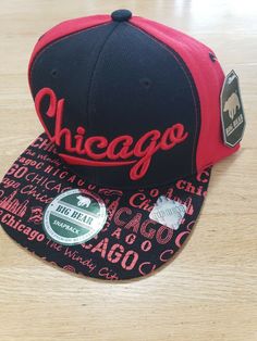 Selling this Big Bear Chicago snapback hat. Colors on it are a mix of red and black. This is new with tags as shown in the photos. Was never used, if even at all. Hat is in amazing condition. Pictures are of the actual snapback hat you will receive no stock photos here. Thanks for looking :)