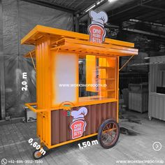 an orange and brown food cart sitting inside of a building