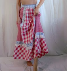 Vintage red gingham picnic prairie skirt. Features contrasting panels of small and big gingham check patterns decorated with lace trims underneath blue fabric. Has a button and snap closure. Skirt is a maxi length. Era: Circa 1960s Condition: Excellent Size: No label, but estimated for a Medium Color: Red, white, blue Brand: No label; Possibly handmade Measurements: 14.25in waist, 37in length Fabric Content: No label, but feels like cotton Model is 5'5 with a 34A bust. Some garments may be clipped onto mannequin or model for display. MORE INFO: *Please, note that all items are vintage. Therefore, it is expected to find some wear. Ariessence by Ariel is an admirer of fashion history and hopes you can appreciate this garment and its character. The condition and any damages will be indicated Prairie Skirt Outfit, Red Gingham Skirt, Prairie Aesthetic, Coral Maxi Skirts, Festival Maxi Skirt, Gingham Picnic, Trendy Outfit Inspo, Prairie Skirt, Gingham Skirt