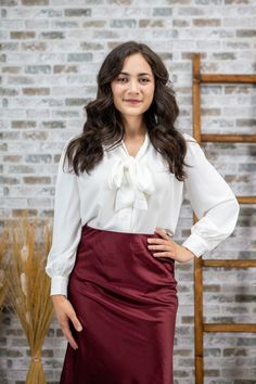 This Sweet as Fall Tied Blouse is crafted with an exquisite eye for detail. The perfect sleeve length is designed to flatter petite women, while the neck tie and luxurious fabric work together to create a loose fit that exudes elegance. Wear it once and no one will be able to resist the beauty of this blouse. Color: White Fabric: 100% Polyester Runs loose. Size down one if you want a more fitted look. Color may vary based on lighting Size chart Sleeve length: 22" Bust Measurements XS = 34-36" S Fall White Blouse With Tie Sleeves, White Tie Sleeve Blouse For Fall, White Tie Sleeves Blouse For Fall, White Blouse With Tie Sleeves For Fall, Chic White Blouse With Tie Sleeves, White Fall Blouse With Bow, White Tie Sleeves Blouse For Office, White Bow Blouse For Work, White Bow Blouse For Workwear