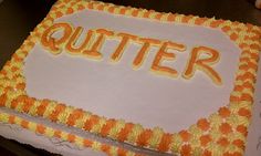 an orange and white cake with the word quitter spelled in frosting on it