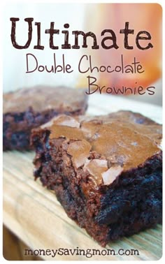 two chocolate brownies sitting on top of a cutting board with the words ultimate double chocolate brownies