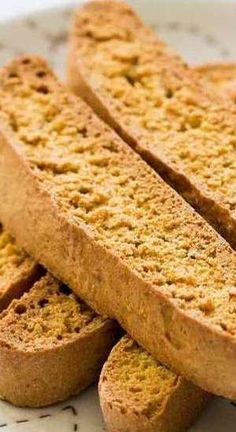 three pieces of bread sitting on top of a white plate