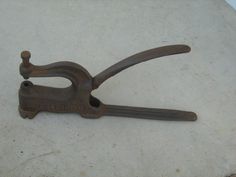 an old pair of scissors sitting on the ground