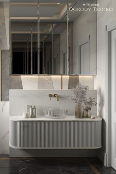 an elegant bathroom with marble counter tops and sinks