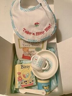 a baby's bib and its contents in a box