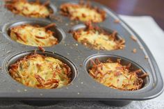 a muffin tin filled with lots of food