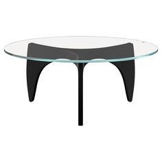 an oval glass table with black legs