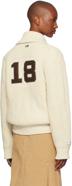 Rib knit wool- and nylon-blend cardigan. · Shawl collar · Two-way zip closure · Logo patch at chest and back collar · Welt pockets · Raglan sleeves · Logo patch at sleeve · Text appliqué at back Supplier color: Ivory White Wool Crew Neck Cardigan, White Wool Polo Sweater For Fall, White Turtleneck Outerwear With Ribbed Collar, White Wool Turtleneck Outerwear, White Wool Outerwear With Crew Neck, White Wool Crew Neck Outerwear, Cardigan Shawl, Shawl Cardigan, Zip Cardigan