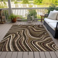 a large area rug is on the porch