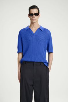 This season, the menswear team take a crafted approach to the classic polo. This electric-blue piece is made from cotton that's open-knitted to create an airiness that's ideal for summer and features a spread collar and side slits to relax the shape. Relaxed fitOrganic cotton is grown from non-genetically modified seeds without chemical fertilizers or pesticides  Shell: 76% Organic cotton, 24% Recycled polyamide. Excluding trims / Machine wash Back length of size M is 25.78" / Model wears a size M Culotte Shorts, Genetically Modified, Vest Shirt, Jumpsuit Trousers, New Arrival Dress, Shop Swimwear, Linen Shirt, Jean Coat, Short Tops