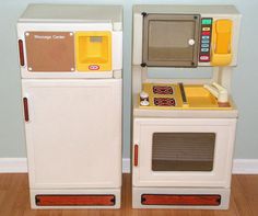 two toy kitchen appliances sitting side by side