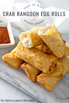 crab rangoon egg rolls on a plate with dipping sauce in the background and text overlay