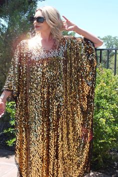 Made to order...Gold Sequin Caftan DressLarge iridescent round sequinLight Gold Sheer lightweight fabricOversized kimono style sleevesOne Size Fits MeasurementsWidth: 46" (armpit to armpit)Total Length : 50-56" CareHand Wash Cold Please allow me 2-3 business days to make the item prior to shipping. Sequin Kimono, Disco Glam, Pakistani Wedding Outfits, Kimono Design, Custom Dress, She Is Clothed, 70s Disco, Fancy Dress Design, Caftan Dress