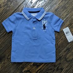 Condition - Nwt Blue Ralph Lauren Cotton Tops, Blue Ralph Lauren Polo Shirt, Navy Ralph Lauren Short Sleeve Tops, Ralph Lauren Polo Collar Tops For Spring, Navy Short Sleeve Ralph Lauren Top, Ralph Lauren Spring Polo Collar Top, Ralph Lauren Blue Polo Collar Shirt, Ralph Lauren Navy Short Sleeve Tops, Blue Cotton Ralph Lauren Polo Shirt