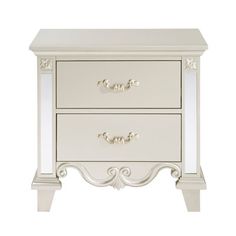 a white nightstand with two drawers on each side and one drawer open to reveal an ornate design