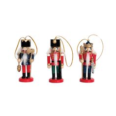 three wooden nutcrackers in different colors and sizes