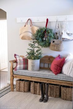 a bench with baskets and christmas decorations on it