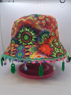 Kevin the alien balloon bucket hat! Perfect for a show or festival!  Size: Medium - One size fits most It is recommended that these bucket hats are handled with care due to the design including dangling charms.  *Each item is handmade and made-to-order so there may be slight varients between each hat in terms of pattern position, charm position, etc. Rave Bucket Hat, Fun Adjustable Hats For Carnival, Playful Adjustable Hat For Carnival, Playful Adjustable Hats For Carnival, Playful Adjustable Carnival Hat, Fun Carnival Festival Costume Hats And Headpieces, Fun Adjustable Mini Hats For Carnival, Fun Adjustable Hat For Carnival, Adjustable Summer Rave Hats