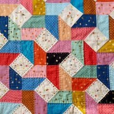 a colorful patchwork quilt with stars on it