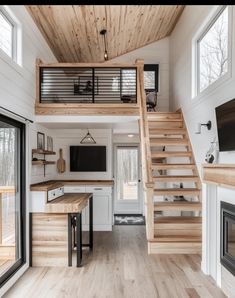 the interior of a tiny house with stairs