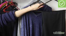 a woman is trying to hang her clothes