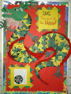 the year of the dragon is made out of construction paper and colored papers with scissors