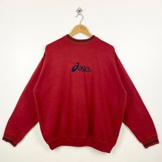 Vintage Asics Crewneck Sweatshirt Embroidery Logo Red Color Men's XL - Made in China - Materials : Cotton, Polyester  - Tag Reads : XL Kindly see the actual measurements (All measurements were taken lying flat) - Actual size manual measurements * Width (Armpit to armpit) : 26 inches * Length (Shoulder to end of garment) : 27 inches * Sleeve length : 24 inches - Condition : * Vintage condition 9/10 (90%) * Free from stain, tear and major defect - Shipping : * DHL Express/FedEx Express = 3-6 busin Red Crew Neck Top With Embroidered Logo, Red Embroidered Crew Neck Sweater, Red Long Sleeve Top With Embroidered Logo, Red Crew Neck Sweatshirt With Embroidered Graphics, Casual Red Sweatshirt With Embroidered Graphics, Red Tops With Embroidered Logo For Fall, Casual Red Embroidered Sweatshirt, Red Embroidered Crew Tops, Casual Red Embroidered Sweater