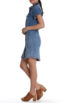 This casual-cool jean dress is designed with abbreviated sleeves and a feathery frayed hem. 35 1/2" front length; 36 1/2" back length Front button closure Spread collar Short sleeves 96% cotton, 3% polyester, 1% spandex Machine wash, tumble dry Imported Denim Blue Dress With Frayed Hem, Medium Wash Denim Dress With Frayed Hem, Washed Blue Denim Dress With Frayed Hem, Trendy Light Wash Denim Dress With Frayed Hem, Trendy Denim Dress With Frayed Hem, Dark Wash Denim Mini Dress With Frayed Hem, Dark Wash Denim Dress With Frayed Hem, Knee-length Cotton Denim Dress With Frayed Hem, Jean Dress