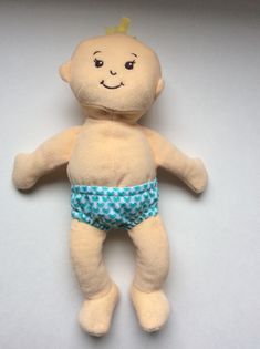 a small stuffed toy with a blue diaper