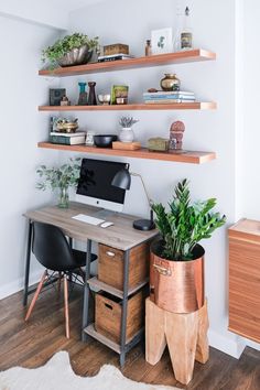 a home office with wooden shelves and plants