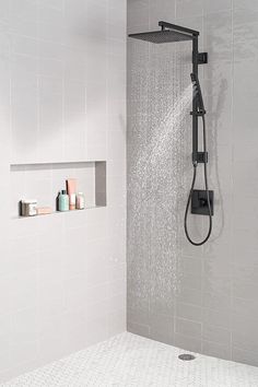 a shower head with thermostaer and soap dispensers in it