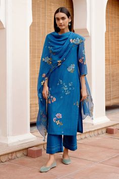 Sapphire blue kurta with thread applique embroidery in floral pattern. Paired with matching pant and dupatta. - Aza Fashions Designer Blue Sharara For Spring, Blue Sharara For Spring, Elegant Sets With Dori Work For Spring, Spring Blue Chanderi Palazzo Set, Spring Sets With Resham Embroidery In Slub Silk, Blue Sets With Embroidered Border For Spring, Slub Silk Palazzo Set With Floral Embroidery, Blue Cotton Palazzo Set With Dupatta, Traditional Slub Silk Sets For Spring