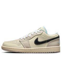 The Air Jordan 1 Low "Sanddrift" offers a fresh perspective on a timeless classic, seamlessly blending understated elegance with the iconic design that has cemented the Air Jordan 1 as a sneaker icon. This iteration presents a refined, minimalist aesthetic, dominated by a soft sanddrift hue that exudes subtle sophistication. The upper is crafted from a harmonious blend of smooth leather and synthetic materials, creating a visually appealing texture. Elevating the design further are the intricate Wmns Air Jordan 1, Fresh Perspective, Limited Edition Sneakers, Heritage Fashion, Air Jordan 1 Low, Synthetic Materials, Jordan 1 Low, Iconic Design, Understated Elegance