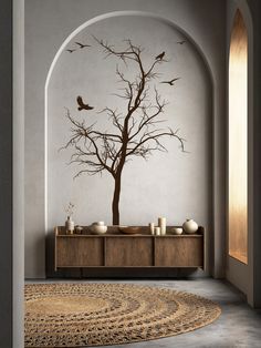 a living room with a tree and birds on the wall