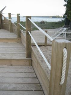 a wooden dock with white rope on it