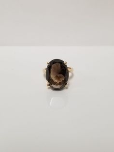 "Thanks for shopping our vintage estate store. We tend to sell well below wholesale and truly hope you enjoy all of our items. Many of the items are one of a kind, so please enjoy scrolling through the pictures and hopefully something will catch your eye. Beautiful estate 14k yellow gold natural 10ct oval cut smoky quartz cocktail ring. There are a few light scratches on the gem, but not noticeable. Ring size: 5.5 Setting: 13mm 1/2\" by 17mm 5/8\" Gem: 10ct Band width: 2mm Weight: 5.86 grams Center gem is stunning and ring is marked 14k." Eye Beautiful, Natural Brown, Cocktail Ring, Smoky Quartz, Cocktail Rings, Oval Cut, Jewelry Rings, Ring Size, Yellow Gold