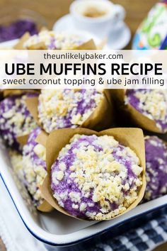 blueberry muffins in wrappers on a plate with text overlay that reads, ube muffins recipe sweet coconut topping & be jam filling