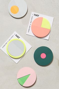 several pieces of paper cut out to look like pies and circles on a table