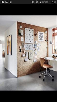 a home office with a cork board wall