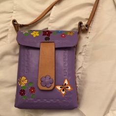 About 8x6 Lavender Purple Cross Body Purse. Painted With Flowers And A Butterfly. Closed With A Magnetic Button. Made In Mexico And Never Used. Everyday Purple Bag With Card Slots, Purple Travel Bag With Card Slots, Purple Pouch Satchel With Adjustable Strap, Purple Satchel With Adjustable Strap In Pouch Shape, Purple Satchel With Adjustable Strap And Pouch Shape, Purple Rectangular Bag With Card Slots, Purple Satchel With Mobile Phone Bag For Everyday Use, Handmade Purple Satchel Shoulder Bag, Handmade Purple Bag