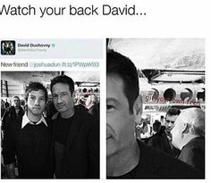 two men standing next to each other in front of a photo with the caption watch your back david