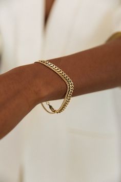 The Capri Curb Chain Collection is an absolute timeless classic — then, now, always. Elevated with subtle detail in the chain, each bracelet is made from a long chain, so each piece is one of a kind. This bracelet is available with or without the single floating 0.1cw diamond set in the chain. Layer up with our Familia Cuban Bracelet. 14k solid gold - always Weighs about 5 grams Chain is approximately 2.5mm thick Diamond Clarity: SI 1-2 We offer custom sizes upon request. Please add the Custom S Bracelets Classy, Necklaces Stacked, Minimal Outfit Ideas, Summer Necklaces, Lux Jewelry, Gold Jewelry Aesthetic, Necklaces Cute, Cuban Bracelet, Ring Concierge