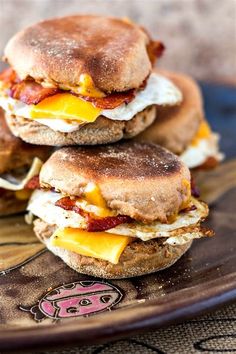 three breakfast sandwiches stacked on top of each other