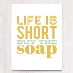 a card with the words life is short, buy the soap on it's front