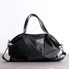 Overview： Design: Nylon Leather Travel Handbag Purse Womens Black Nylon Shoulder Bag Nylon Gym Purse for LadiesIn Stock: Ready to Ship (2-4 days)Include: Only BagCustom: NoColor: BlackLeather: Nylon, LeatherMeasures: 45 cm x 33cm x 20cm Weight: 0.65kgSlots: 2 main slots, 2 zipper slot, 1 phone pocket, 1 wallet pocket, 2 side slotsAccessories(option): NoneStyle: Nylon Leather Travel Handbag Purse Womens Black Nylon Shoulder Bag Nylon Gym Purse for LadiesVery durable (At least 5 Years) and it shou Black Shoulder Bag With Leather Handles For Commuting, Black Nylon Bag With Removable Pouch, Nylon Bags With Large Capacity For Commuting, Nylon Tote Shoulder Bag For Commuting, Black Nylon Bag For Everyday Use, Black Nylon Satchel Shoulder Bag, Large Capacity Nylon Bag For Commuting, Nylon Commuting Shoulder Tote Bag, Nylon Shoulder Bag With Removable Pouch For Commuting