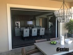 a dining room table sitting next to a glass door